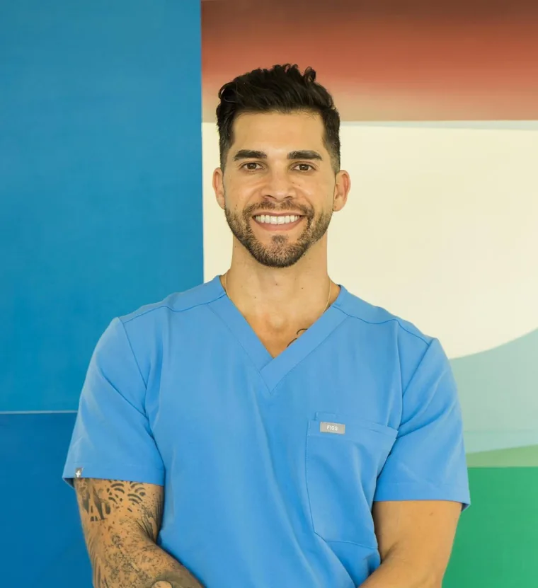 Dr. Joel Wussow, MD, in clinical scrubs